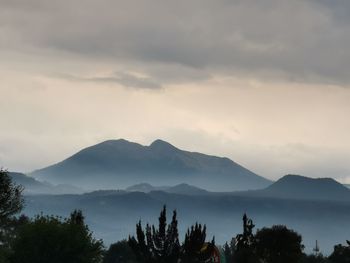 Scenic view of silhouette mountains against sky