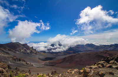 Scenic view of landscape against cloudy sky