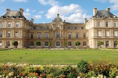 View of jardin du luxembourg in paris against cloudy sky