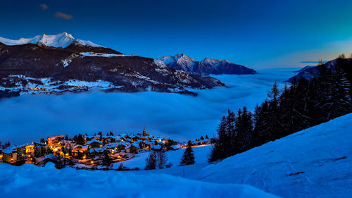 Scenic view of snowcapped mountains and cloudscape