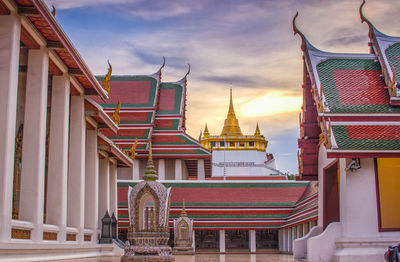 View of temple building against cloudy sky