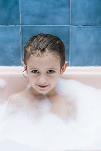 Portrait of boy in bathtub