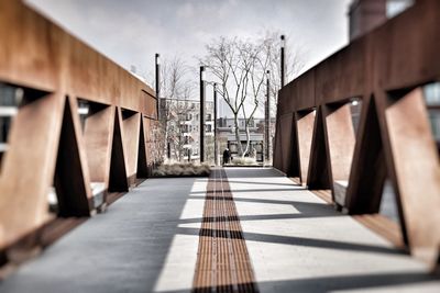 Bridge in city against sky