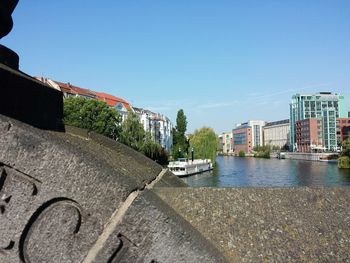 View of buildings against clear blue sky