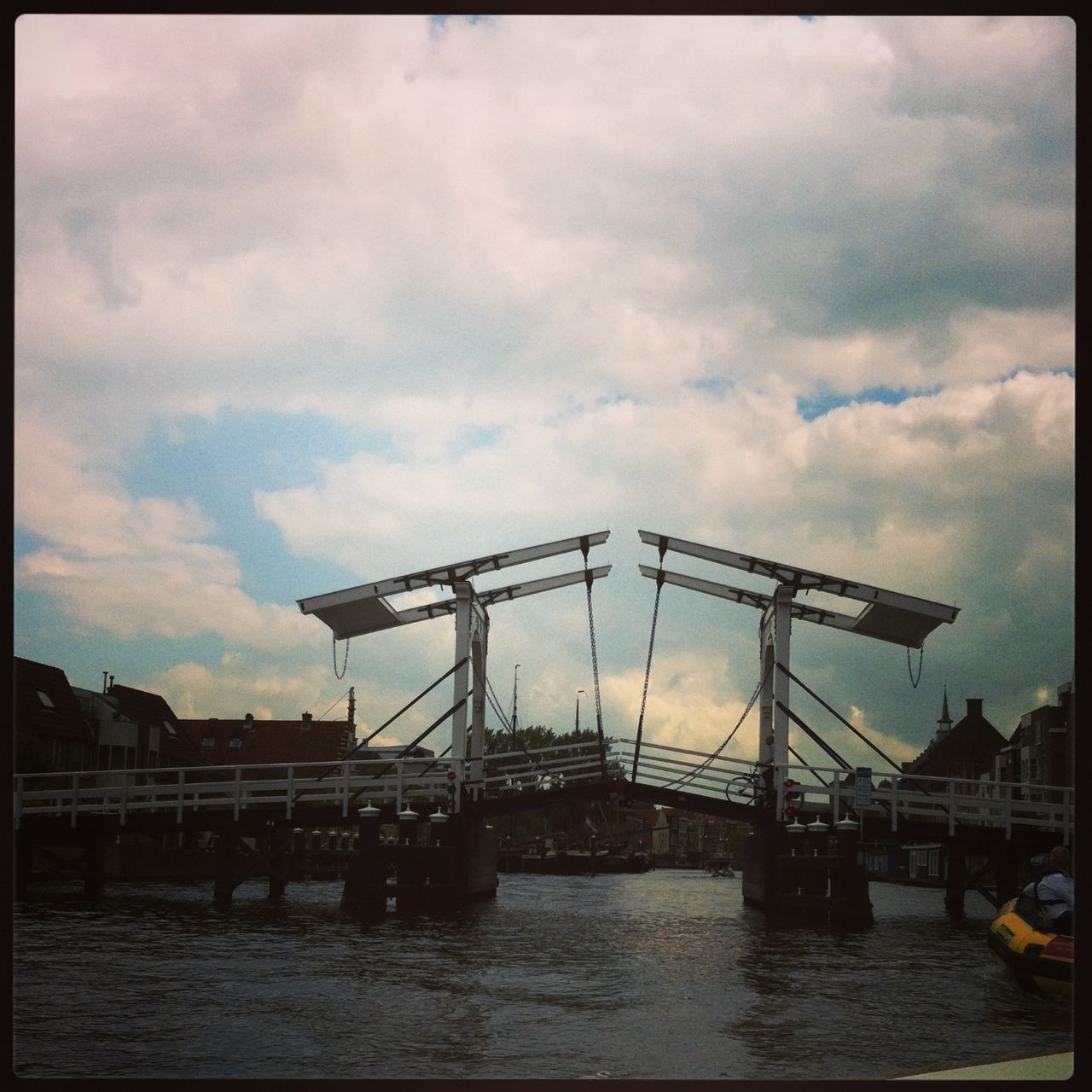 sky, transfer print, built structure, architecture, water, cloud - sky, auto post production filter, waterfront, building exterior, cloudy, sea, cloud, nautical vessel, transportation, harbor, river, pier, outdoors, connection, dusk