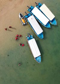 High angle view of boats moored at beach