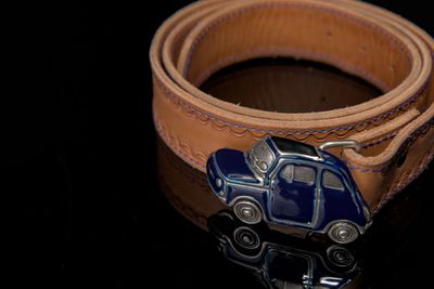 High angle view of vintage car on table against black background