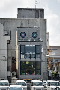 Cars against buildings in city