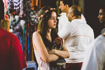 Side view of young couple standing outdoors