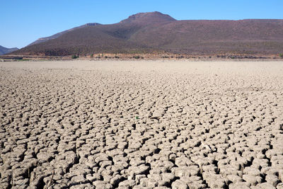 Scenic view of desert against clear sky