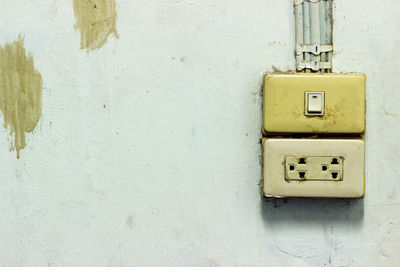 Close-up of telephone on wall