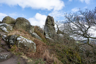 Low angle view of rocks against sky