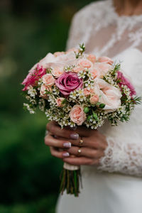 Wedding details, groom, bride, boquette, boutonnière 