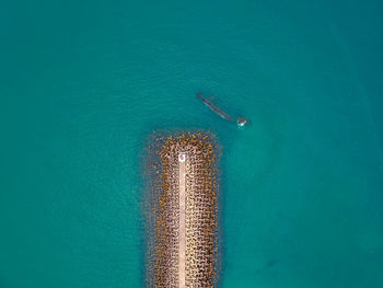 High angle view of sea against blue sky