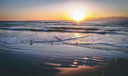 Scenic view of sea against sky during sunset