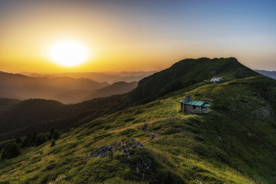 Scenic view of mountains against sky during sunset