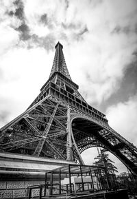 Low angle view of tower against cloudy sky