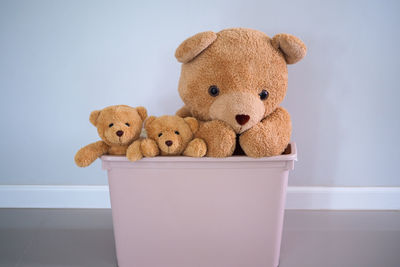 Close-up of stuffed toy against wall