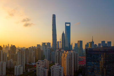 View of modern buildings against sky during sunset