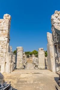 Ruins of temple against clear blue sky