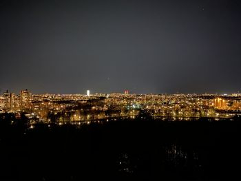 Illuminated buildings in city at night