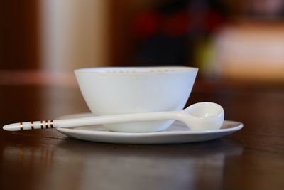 Close-up of coffee cup on table