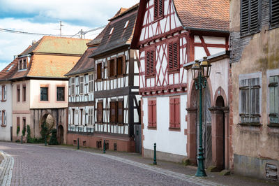 Road in the alsace in france, oberbronn with old house, town of storks, timbered houses
