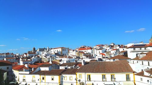 Residential district against blue sky