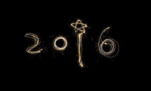 Close-up of illuminated lamp over black background