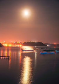 Scenic view of sea against sky at night