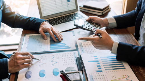 High angle view of business people working on table