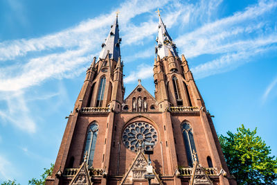 Low angle view of cathedral against cloudy sky