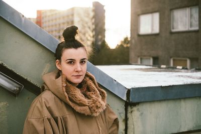 Portrait of young woman in city