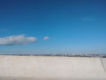 Scenic view of sea against sky in city