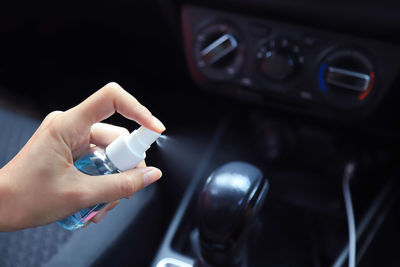 Close-up of hand holding car