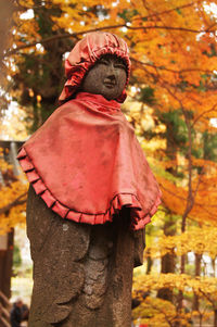 Close-up of person standing by tree during autumn