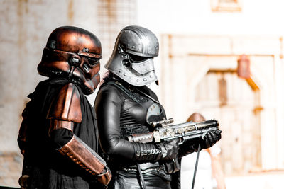 People wearing costume and helmets