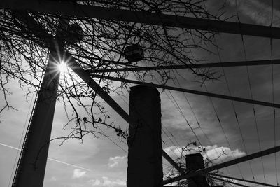 Low angle view of electricity pylon against sky