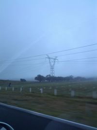 Electricity pylon on field