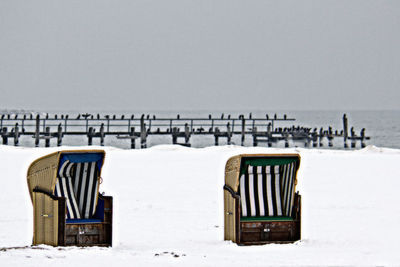 Empty bench in snow