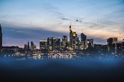 Illuminated city at waterfront