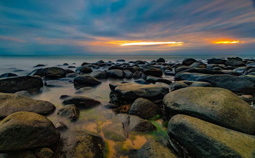 Scenic view of sea at sunset