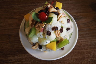 High angle view of fruits in plate on table