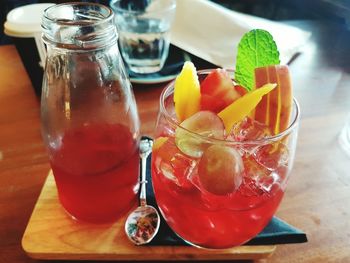 Close-up of iced tea in glass served on table