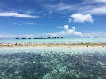 Scenic view of sea against blue sky