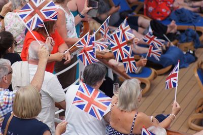 High angle view of people with british flags in city