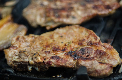 Close-up of meat on barbecue