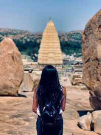 Rear view of woman looking at temple