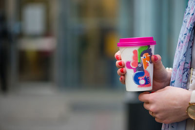 Midsection of woman holding ice cream