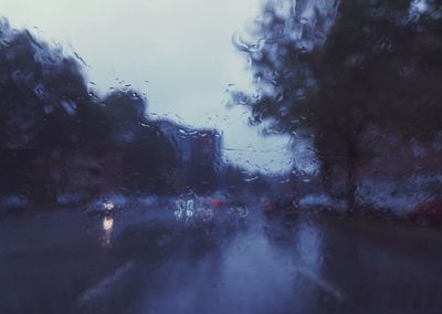 Close-up of wet window during rainy season